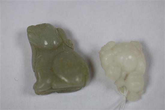 A Chinese white jade two boys carving and a celadon jade lion-dog, H. 3.7cm and 4.4cm